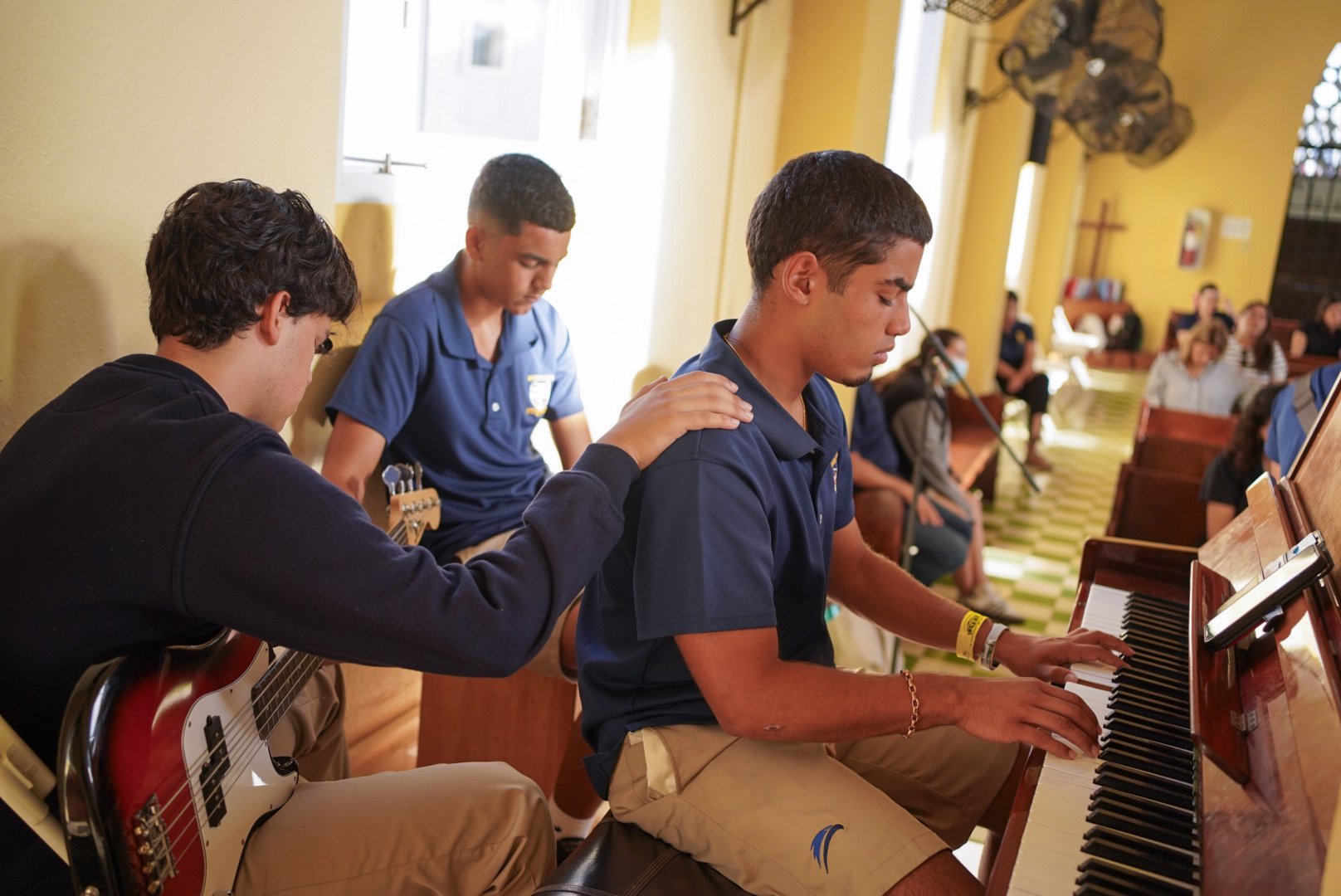 Students leading worship in the Robinson School chapel
